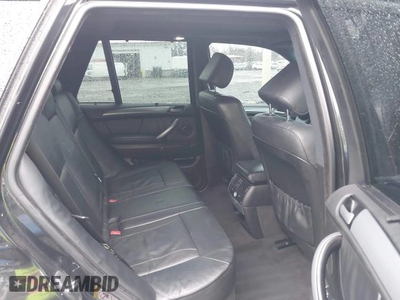 2005 BMW X5 4.8is with VIN 5UXFA93515LE82570, listed as a IAAI auction lot 41759657 with 212,687 mi miles. Bid and sale history available at carsss.com. Image 8.