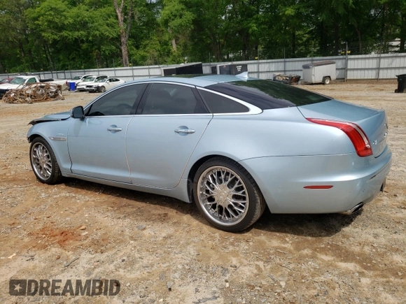 2013 Jaguar XJ with VIN SAJWA1C77D8V41738, listed as a Copart auction lot 53796225 with 104,063 mi miles and Salvage Title. Bid and sale history available at DreamBid. Image 2.