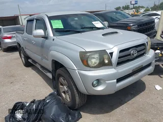 2009 Toyota Tacoma with VIN 3TMLU42N69M032320, listed as a IAAI auction lot 42280196 with 214,720 mi miles and . Bid and sale history available at DreamBid. Image 1.