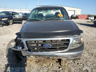 2002 Ford F-150 XL z VIN 2FTRF18W12CA41575, wystawiony jako Copart lot #75248554 z przebiegiem Nie podano mil oraz Szkoda całkowita • Salvage title. Historia ofert i sprzedaży dostępna na DreamBid. Obrazek 5.
