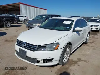 2014 Volkswagen Passat TDI SE w/Sunroof with VIN 1VWBN7A32EC016554, listed as a IAAI auction lot 41472156 with 178,149 mi miles. Bid and sale history available at carsss.com. Image 2.