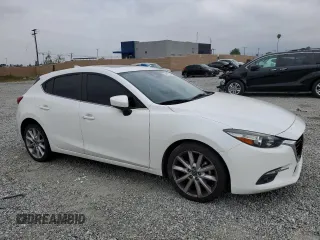 2017 Mazda 3 Grand Touring with VIN JM1BN1M35H1122136, listed as a Copart auction lot 54458755 with 62,515 mi miles and Salvage Title. Bid and sale history available at DreamBid. Image 4.