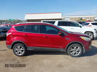 2014 Ford Escape Titanium with VIN 1FMCU0J91EUE12034, listed as a IAAI auction lot 42027493 with 160,417 mi miles and . Bid and sale history available at DreamBid. Image 13.