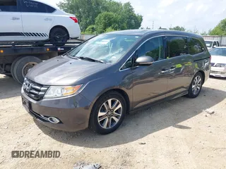 2014 Honda Odyssey Touring with VIN 5FNRL5H99EB138952, listed as a IAAI auction lot 42538833 with 146,959 mi miles and . Bid and sale history available at DreamBid. Image 2.