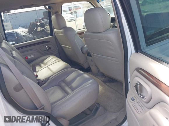 1999 Cadillac Escalade with VIN 1GYEK13R0XR415674, listed as a IAAI auction lot 40003144 with 80,959 mi miles and . Bid and sale history available at DreamBid. Image 8.