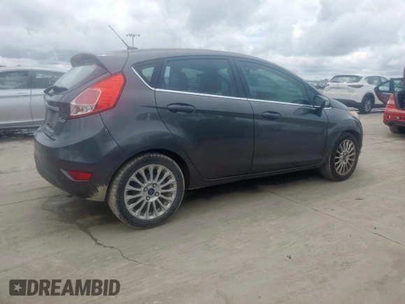 2015 Ford Fiesta Titanium z VIN 3FADP4FJ5FM203174, wystawiony jako Copart lot #60727515 z przebiegiem 91 898 mil mil oraz Czysty tytuł • Clean title. Historia ofert i sprzedaży dostępna na DreamBid. Obrazek 3.
