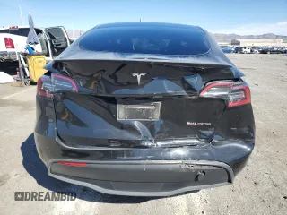 2023 Tesla Model Y Performance with VIN 7SAYGDEF7PF924355, listed as a Copart auction lot 47877055 with 64,663 mi miles and Salvage Title. Bid and sale history available at DreamBid. Image 6.