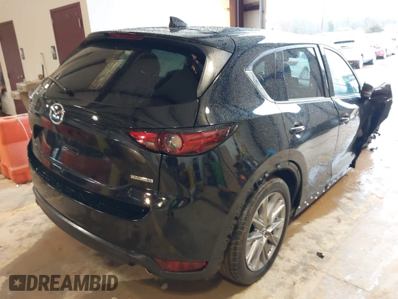 2020 Mazda CX-5 Grand Touring with VIN JM3KFADM3L0742625, listed as a IAAI auction lot 41715580 with 45,562 mi miles. Bid and sale history available at carsss.com. Image 4.