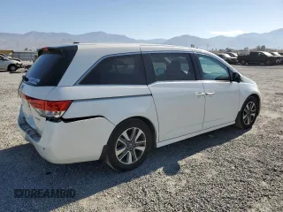 2016 Honda Odyssey Touring Elite with VIN 5FNRL5H9XGB006981, listed as a Copart auction lot 63970385 with 165,164 mi miles and Salvage title. Bid and sale history available at DreamBid. Image 3.