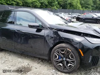 2024 BMW iX xDrive50 with VIN WB523CF09RCP70617, listed as a Copart auction lot 58091014 with 2,539 mi miles and Salvage Title. Bid and sale history available at carsss.com. Image 4.