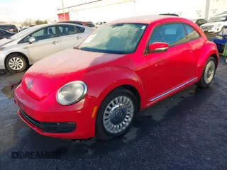 2014 Volkswagen Beetle 2.5L w/Sun with VIN 3VWJP7AT8EM629573, listed as a IAAI auction lot 41479054 with 73,950 mi miles and . Bid and sale history available at DreamBid. Image 2.