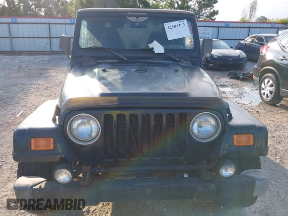 2000 Jeep Wrangler Sahara with VIN 1J4FA59SXYP718029, listed as a IAAI auction lot 42583372 with 260,811 mi miles and . Bid and sale history available at DreamBid. Image 12.