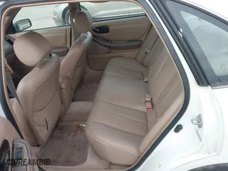 1997 Toyota Avalon XL with VIN 4T1BF12B1VU144017, listed as a IAAI auction lot 41602761 with 163,955 mi miles. Bid and sale history available at carsss.com. Image 8.
