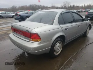 1996 Saturn SL with VIN 1G8ZK5272TZ265571, listed as a Copart auction lot 51267475 with 142,824 mi miles and Salvage Title. Bid and sale history available at carsss.com. Image 3.