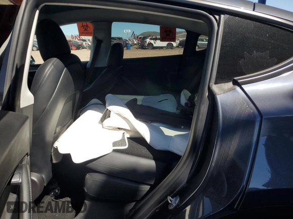 2022 Tesla Model Y Long Range z VIN 7SAYGDEE3NF543705, wystawiony jako Copart lot #50244955 z przebiegiem 59 063 mil mil oraz Szkody całkowita. Historia ofert i sprzedaży dostępna na DreamBid. Obrazek 10.