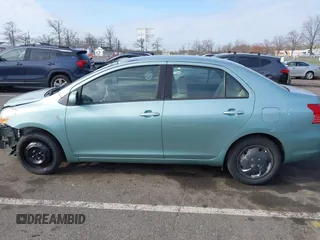 2009 Toyota Yaris with VIN JTDBT903794060474, listed as a IAAI auction lot 42005903 with 104,607 mi miles. Bid and sale history available at carsss.com. Image 14.