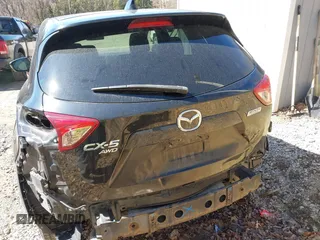 2014 Mazda CX-5 Touring with VIN JM3KE4CY8E0333029, listed as a IAAI auction lot 41857199 with 218,887 mi miles. Bid and sale history available at carsss.com. Image 16.