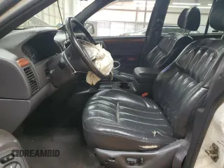 1999 Jeep Grand Cherokee Limited с VIN 1J4GW68S8XC627893, выставлен на аукционе Copart как лот 53284365 с пробегом 233 996 миль миль и Списание • Salvage title. История ставок и продаж доступна на DreamBid. Изображение 7.