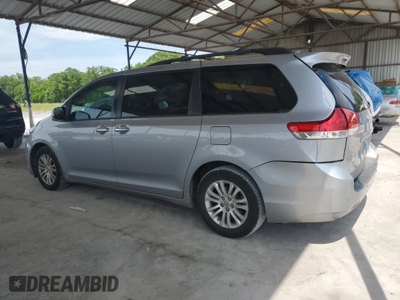2012 Toyota Sienna XLE AAS с VIN 5TDYK3DC1CS240100, выставлен на аукционе Copart как лот 56975235 с пробегом 251 340 миль миль и Списание • Salvage title. История ставок и продаж доступна на DreamBid. Изображение 2.