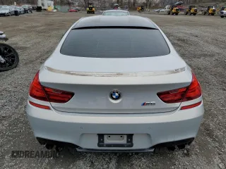 2014 BMW M6 z VIN WBS6C9C5XED467254, wystawiony jako Copart lot #50335275 z przebiegiem 67 534 mil mil oraz Szkoda całkowita • Salvage title. Historia ofert i sprzedaży dostępna na DreamBid. Obrazek 6.
