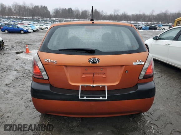 2009 Kia Rio LX with VIN KNADE243396530327, listed as a Copart auction lot 44631785 with 123,170 mi miles and Salvage Title. Bid and sale history available at carsss.com. Image 6.