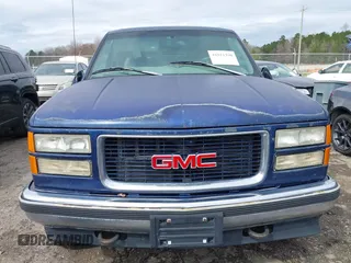 1997 GMC Yukon with VIN 1GKEK13R6VJ715421, listed as a IAAI auction lot 41811398 with 214,735 mi miles. Bid and sale history available at carsss.com. Image 6.