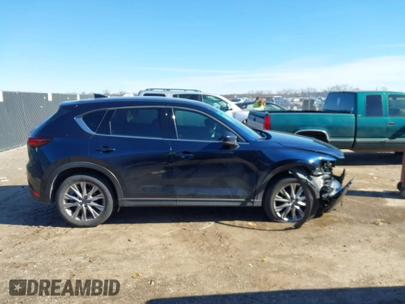 2019 Mazda CX-5 Grand Touring with VIN JM3KFBDM2K1685168, listed as a IAAI auction lot 41323598 with 88,429 mi miles. Bid and sale history available at carsss.com. Image 13.