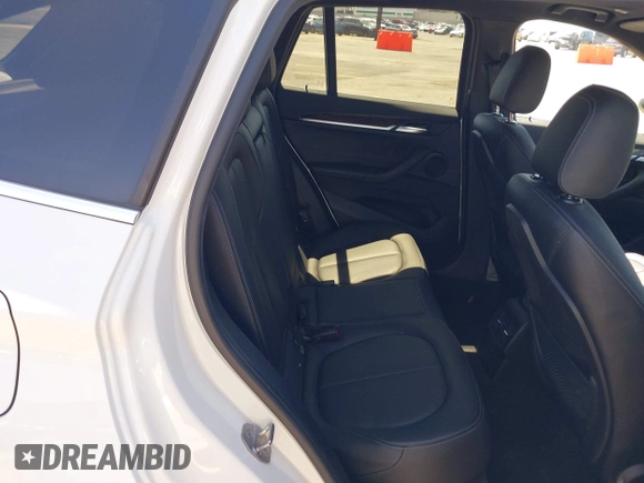 2017 BMW X1 xDrive28i with VIN WBXHT3C33H5F86831, listed as a IAAI auction lot 42019082 with 74,708 mi miles and . Bid and sale history available at DreamBid. Image 8.