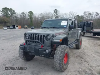2021 Jeep Gladiator Rubicon with VIN 1C6JJTBG7ML554354, listed as a IAAI auction lot 41796943 with 61,513 mi miles and . Bid and sale history available at DreamBid. Image 18.