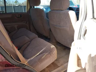 2001 GMC Jimmy SL with VIN 1GKCS13W012143344, listed as a IAAI auction lot 41385552 with 216,127 mi miles. Bid and sale history available at carsss.com. Image 8.