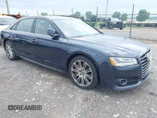 2016 Audi A8 Sport z VIN WAU43AFD4GN017144, wystawiony jako IAAI lot #42265836 z przebiegiem 108 785 mil mil oraz . Historia ofert i sprzedaży dostępna na DreamBid. Obrazek 1.