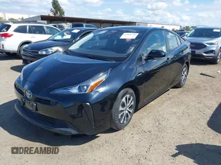 2021 Toyota Prius L Eco with VIN JTDKAMFU6M3135799, listed as a IAAI auction lot 42064241 with 77,120 mi miles and . Bid and sale history available at DreamBid. Image 17.