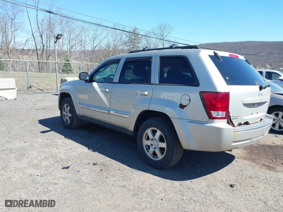 2010 Jeep Grand Cherokee Laredo with VIN 1J4PR4GK2AC125918, listed as a IAAI auction lot 41899078 with 236,229 mi miles. Bid and sale history available at carsss.com. Image 3.