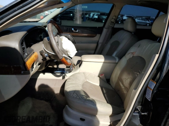 2001 Lincoln Continental with VIN 1LNHM97V61Y604213, listed as a Copart auction lot 52517535 with 112,391 mi miles and Salvage Title. Bid and sale history available at DreamBid. Image 7.
