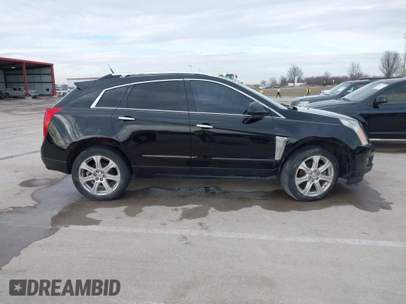 2013 Cadillac SRX Performance Collection with VIN 3GYFNHE34DS595277, listed as a IAAI auction lot 41618126 with 118,141 mi miles. Bid and sale history available at carsss.com. Image 13.