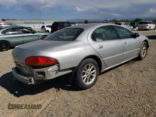 2001 Chrysler LHS z VIN 2C3HC56G11H643759, wystawiony jako Copart lot #70924974 z przebiegiem 124 263 mil mil oraz Tytuł czysty. Historia ofert i sprzedaży dostępna na DreamBid. Obrazek 3.