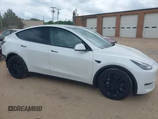 2021 Tesla Model Y Long Range with VIN 5YJYGDEE7MF198867, listed as a IAAI auction lot 42117463 with 79,759 mi miles and . Bid and sale history available at DreamBid. Image 13.