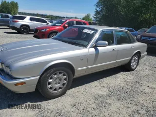 1999 Jaguar XJ with VIN SAJHD1047XC871858, listed as a Copart auction lot 62715155 with 125,536 mi miles and Salvage title. Bid and sale history available at DreamBid. Image 1.