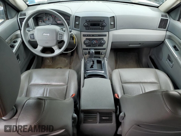 2005 Jeep Grand Cherokee Laredo with VIN 1J4GR48KX5C565762, listed as a Copart auction lot 63080115 with 122,349 mi miles and Salvage title. Bid and sale history available at DreamBid. Image 8.