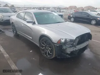 2014 Dodge Charger SE with VIN 2C3CDXBG8EH268788, listed as a IAAI auction lot 41223495 with 115,048 mi miles. Bid and sale history available at carsss.com. Image 1.