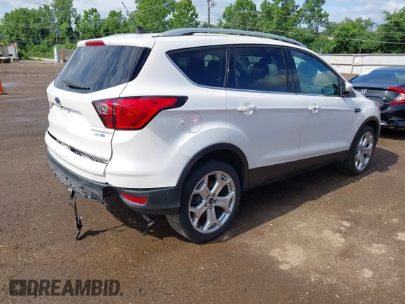 2019 Ford Escape Titanium with VIN 1FMCU9J98KUA95238, listed as a IAAI auction lot 42525324 with 59,222 mi miles and . Bid and sale history available at DreamBid. Image 4.