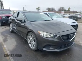 2016 Mazda 6 i Touring with VIN JM1GJ1V52G1473330, listed as a IAAI auction lot 41657684 with 138,064 mi miles and . Bid and sale history available at DreamBid. Image 1.
