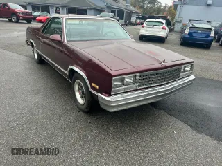 1986 Chevrolet El Camino z VIN 3GCCW80Z0GS907956, wystawiony jako Copart lot #76346574 z przebiegiem 70 946 mil mil oraz Czysty tytuł • Clean title. Historia ofert i sprzedaży dostępna na DreamBid. Obrazek 1.