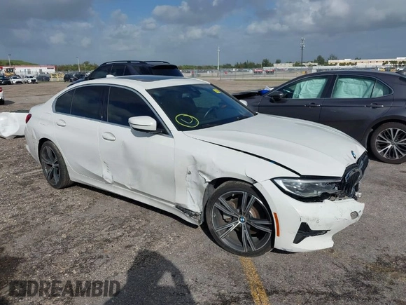 2021 BMW 3 Series 330i with VIN 3MW5R1J00M8B52627, listed as a IAAI auction lot 40722823 with 36,769 mi miles. Bid and sale history available at carsss.com. Image 1.