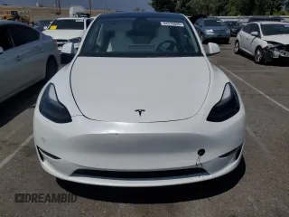 2022 Tesla Model Y Performance with VIN 7SAYGDEFXNF407340, listed as a Copart auction lot 54376895 with 56,709 mi miles and Salvage Title. Bid and sale history available at DreamBid. Image 5.