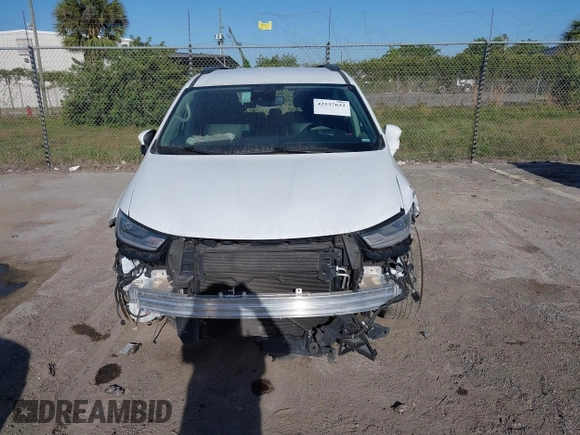 2022 Chrysler Pacifica Touring L with VIN 2C4RC1BGXNR233654, listed as a IAAI auction lot 42137632 with 73,899 mi miles and . Bid and sale history available at DreamBid. Image 13.