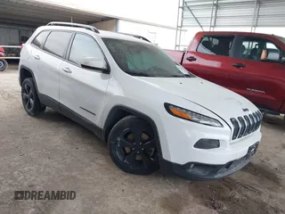 2016 Jeep Cherokee Latitude with VIN 1C4PJLCB5GW207159, listed as a IAAI auction lot 41232649 with 103,991 mi miles. Bid and sale history available at carsss.com. Image 1.