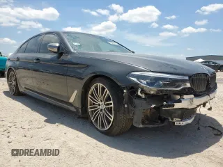 2019 BMW 5 Series M550i xDrive with VIN WBAJB9C51KB287797, listed as a Copart auction lot 65382465 with 61,459 mi miles and Salvage title. Bid and sale history available at DreamBid. Image 4.