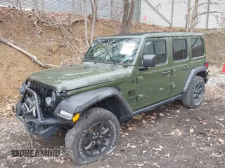 2021 Jeep Wrangler Unlimited Willys with VIN 1C4HJXDNXMW579595, listed as a IAAI auction lot 41930989 with 32,148 mi miles and . Bid and sale history available at DreamBid. Image 18.