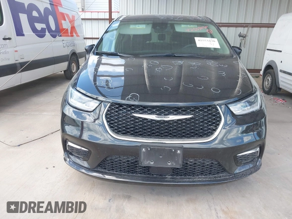 2023 Chrysler Pacifica Touring L with VIN 2C4RC1BG1PR550628, listed as a IAAI auction lot 42553430 with 61,773 mi miles and . Bid and sale history available at DreamBid. Image 13.